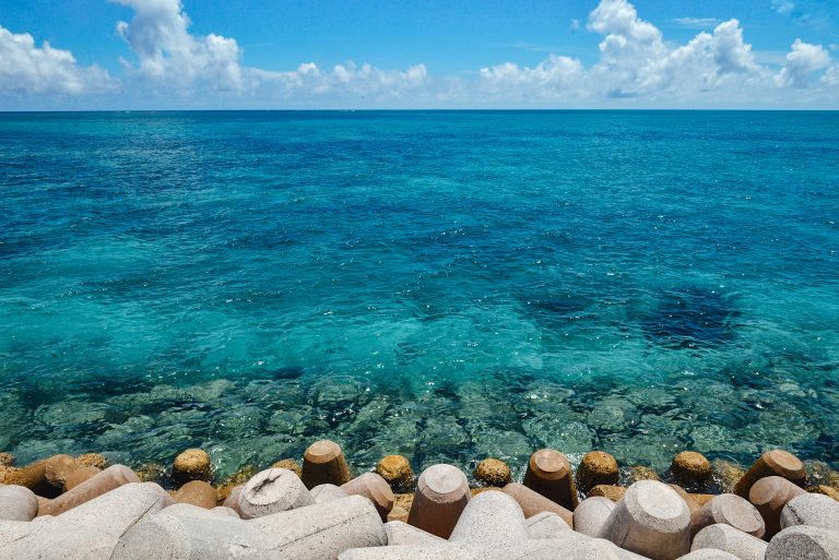 Clear turquoise water along a quiet shore